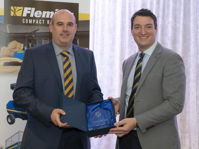 Bready's Robert Spence receives the 'Coach of the Year' award from NW Cricket General Manager Peter McCartney at the annual presentation evening.