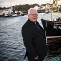 Fr. George McLaughlin pictured previously at Greencastle Harbour. DER4515MC025