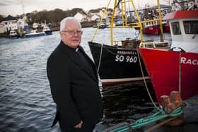 Fr. George McLaughlin pictured previously at Greencastle Harbour. DER4515MC025