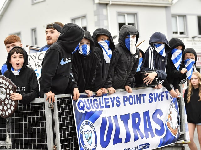 Muff Feile opening parade makes its way through the village on Friday evening. Photo: George Sweeney