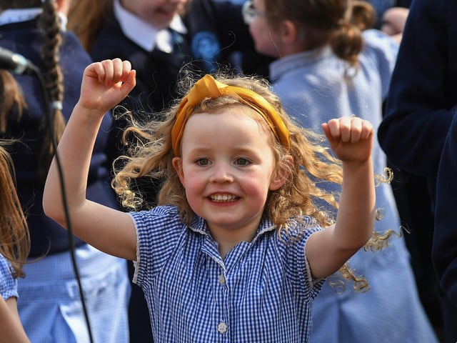 A Rosemount Primary School pupil dancing to the music and song of the Jive Aces on Thursday morning. Photo: George Sweeney