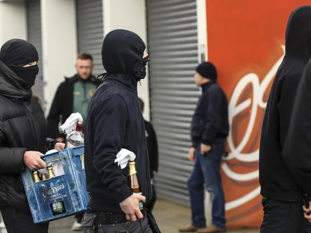 Hooded teenagers carrying petrol bombs at the Saoradh Easter Commemoration leaving Creggan Shop to City Cemetery.  (Photo - Tom Heaney, nwpresspics)