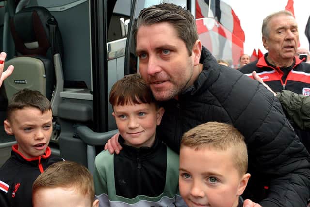 Derry City’s manager Ruaidhrí Higgins has a picture taken with fans prior to the team’s departure for Dublin ahead of the FAI Cup Final against Shelbourne. George Sweeney.  DER2244GS – 57