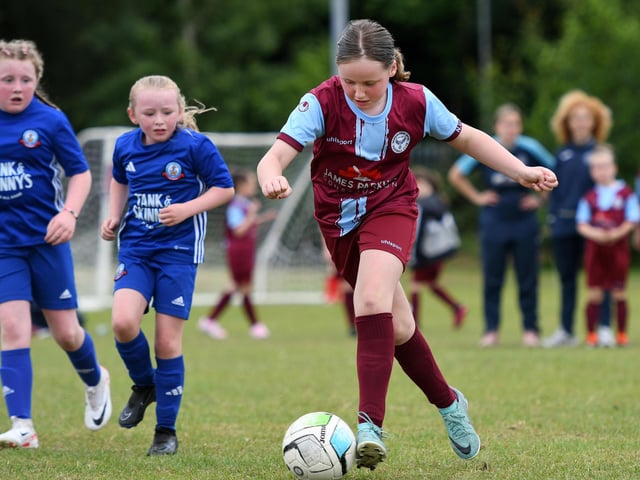 Harper Thompson on the ball for Newbuildings United during their girls under-9's match against Buncrana Hearts.