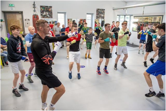 World middleweight contender Connor Coyle takes some of the young William Wallace Box Cup boxers through their paces at St Joseph's ABC