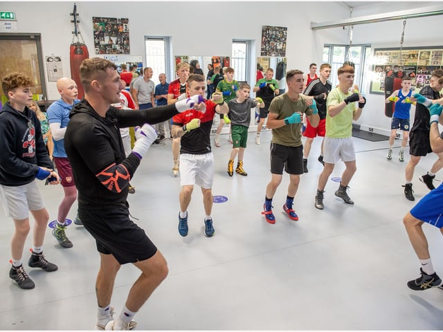 World middleweight contender Connor Coyle takes some of the young William Wallace Box Cup boxers through their paces at St Joseph's ABC