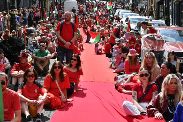 Supporters of the ‘Turn Shipquay Street Red for Gaza’ march on Shipquay Street on Saturday afternoon. Photo: George Sweeney
