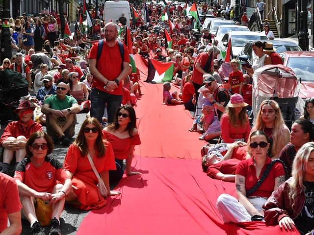 Supporters of the ‘Turn Shipquay Street Red for Gaza’ march on Shipquay Street on Saturday afternoon. Photo: George Sweeney