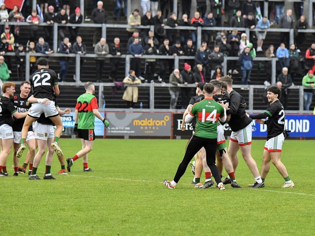 Slaughtmanus players celebrate winning the Derry Junior Football Championship Joe Brolly Cup at Celtic Park on Sunday afternoon. Photo: George Sweeney