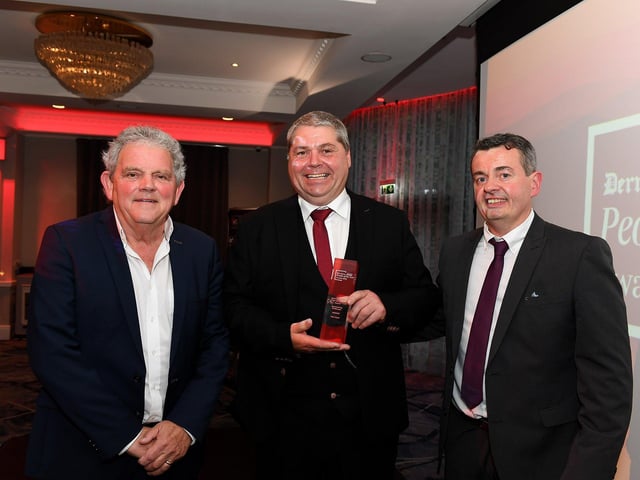 Sports Volunteer of the Year Award winner Alan Nash receives his award from Bet McLean Area manager John Gallagher and compere Adrian Logan. Photo: George Sweeney