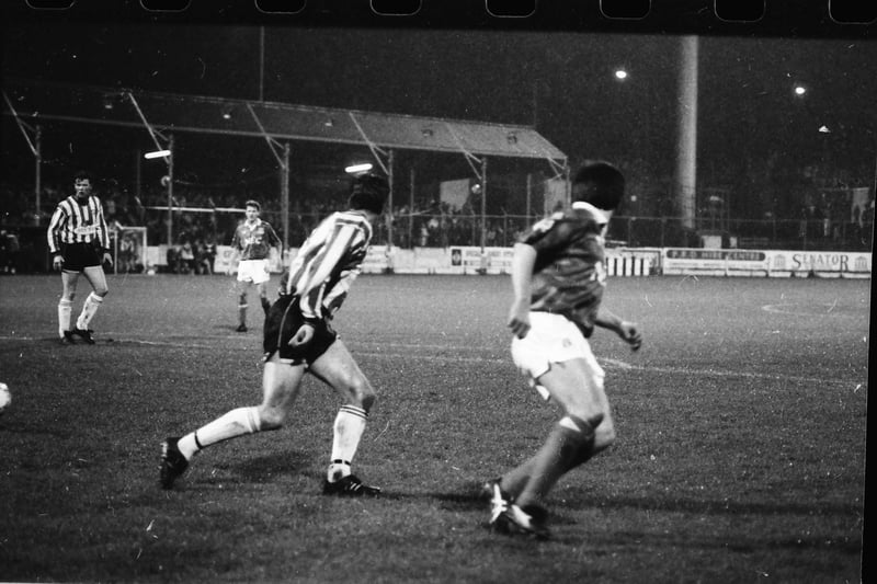 Peter Beardsley and Stuart Gauld in action during Derry City's clash with Everton at the Brandywell as Donal O'Brien looks on.