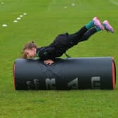 Young participant develops her tackling skills at the recent City of Derry Youth Rugby Summer Camp.  Photo: George Sweeney. DER2331GS – 53