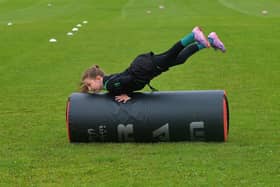 Young participant develops her tackling skills at the recent City of Derry Youth Rugby Summer Camp.  Photo: George Sweeney. DER2331GS – 53