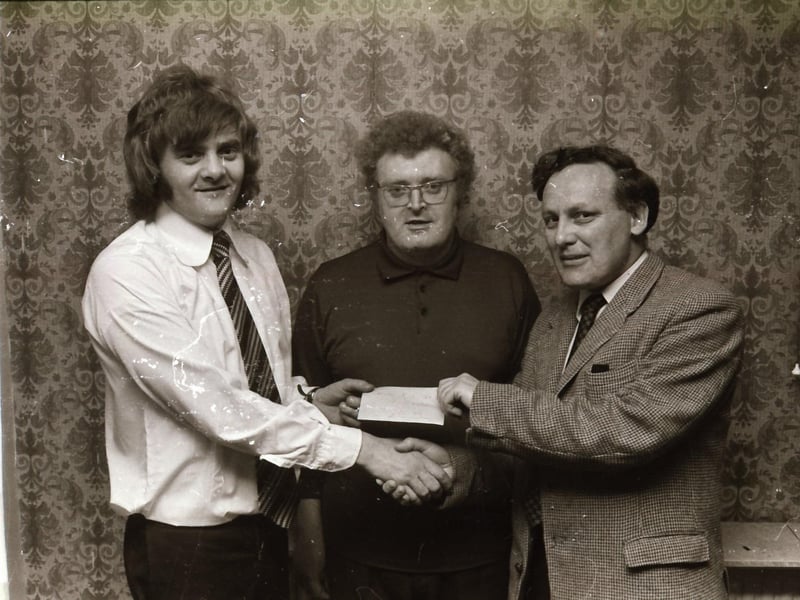 Mr Kieran Mellon, proprietor at the Capitol Bar presenting a cheque to Derry City Social Club, the winning team in the knock out annual quiz.