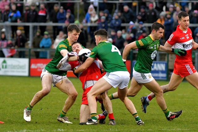 Meath pair Adam O’Neill and Harry O’Higgins grapple with Derry’s Niall Loughlin during the Allianz Football League game at Owenbeg on Saturday. Photo: George Sweeney. DER2308GS – 52