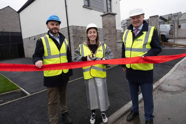 1. Mayor of Derry City and Strabane District Council, Cllr Grace Uí Niallais, helps officially open The Cashel housing development, alongside Ryan Boyle, Managing Director of the Braidwater Group, and Liam Hannaway, Chair of Apex Housing Association.