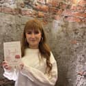 Aimée Donnell with her debut book: ‘We Are All Creatures of Struggle.’
