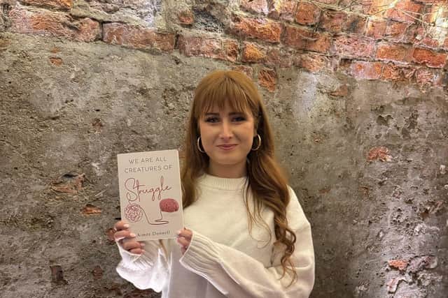 Aimée Donnell with her debut book: ‘We Are All Creatures of Struggle.’