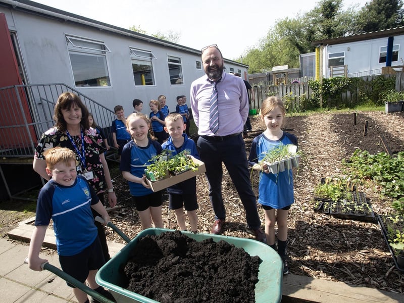 Mr. Feargal Friel, Principal, on hand to offer some gardening advice to the pupils on Tuesday.