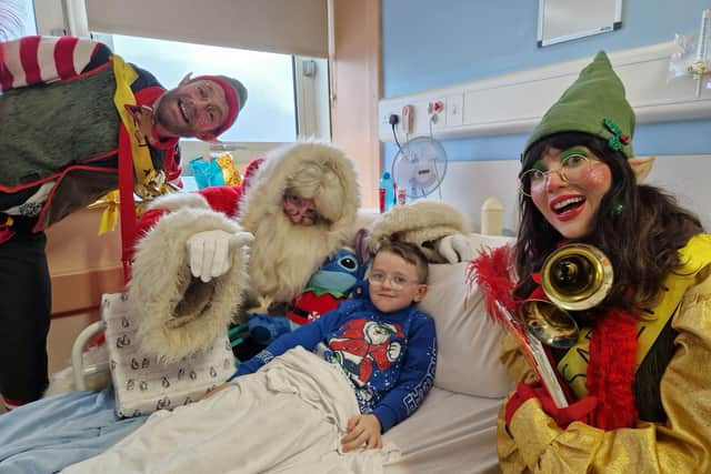 Santa and his helpers visiting the Children's Ward in Altnagelvin Hospital.