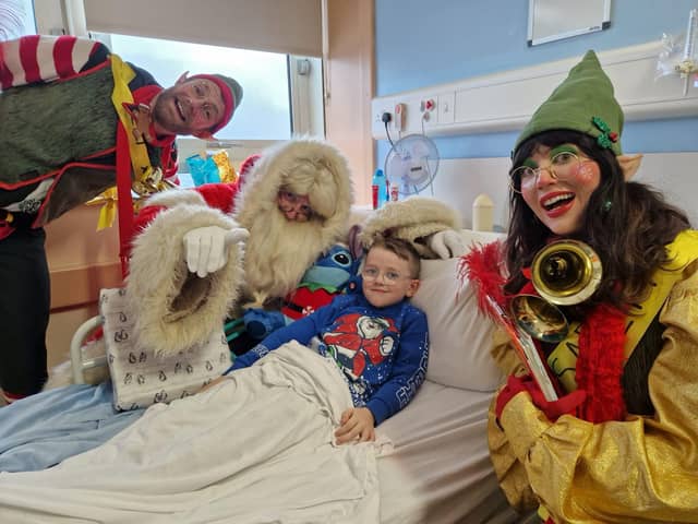 Santa and his helpers visiting the Children's Ward in Altnagelvin Hospital.