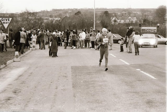 Spectators gather to watch the action at the 1983 Male Mini Marathon in Derry.