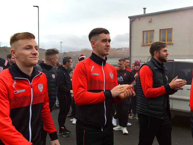 Derry City players greet fans gathered at Brandywell Stadium on Saturday morning prior to their departure for Dublin ahead of tomorrow’s FAI Cup Final against Shelbourne. George Sweeney. DER2244GS – 52