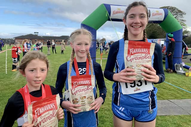 Sadhbh Callan (2nd), Maeve O’Donnell (1st) and Maria Devine (3rd) at the first round of the Flahavan’s Athletics NI Primary School Cross Country League which took place at Thornhill College.