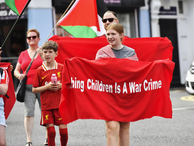The ‘Turn Shipquay Street Red for Gaza’ march makes its way along Bishop Street  towards Shipquay Street on Saturday afternoon. Photo: George Sweeney