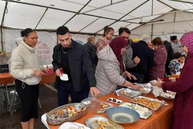 Sampling food at North West Islamic Association ‘s Tea and Tour day in Pennyburn on Sunday afternoon last. Photo: George Sweeney. DER2311GS – 17