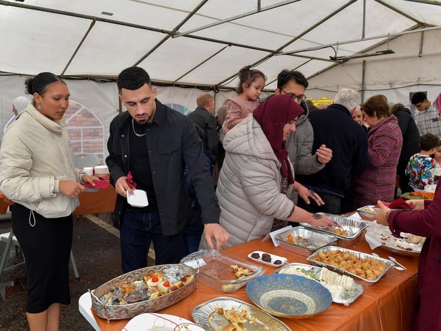 Sampling food at North West Islamic Association ‘s Tea and Tour day in Pennyburn on Sunday afternoon last. Photo: George Sweeney. DER2311GS – 17