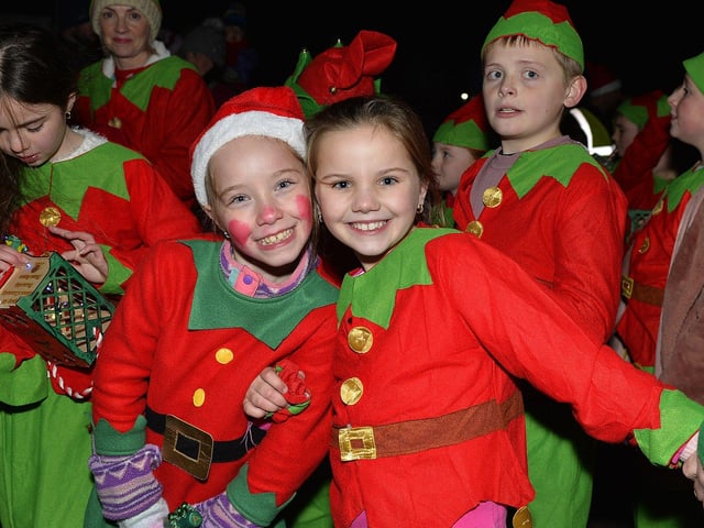 Culmore Community Partnership Elf Parade makes its way towards the Community Hub on Friday night. Photo: George Sweeney