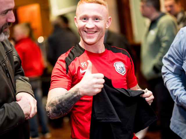 Paul Fox gets himself some merchandise at the Brawl in the Hall.
