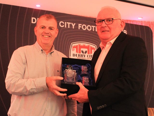 Derry City CEO Sean Barrett receives his special award from Commercial Manager, Robert Martin.