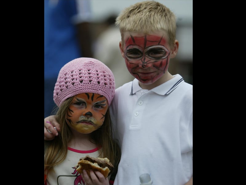 Georgia and Jordan Logue have a happy meal at St. \Anne's PS fete.  (0306JB15)