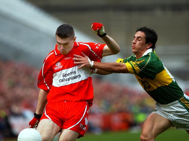 Mark Lynch gets his shots away despite Kerry pressure in Croke Park.
