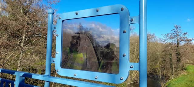New 'Ghosts of Tooban Junction' sign at Inch, showing a window to our pas
