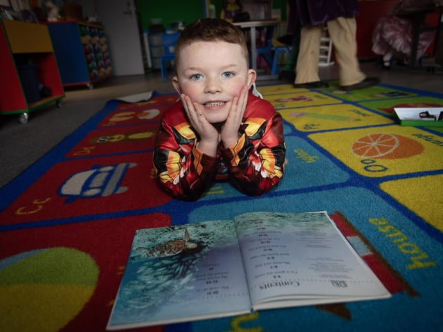 Primary 2 pupil Riley enjoying some reading time at Steelstown PS.
