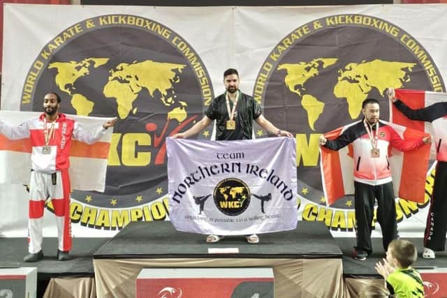 Andy Brett with his gold medal at the World Karate and Kickboxing Championships held in Portugal.