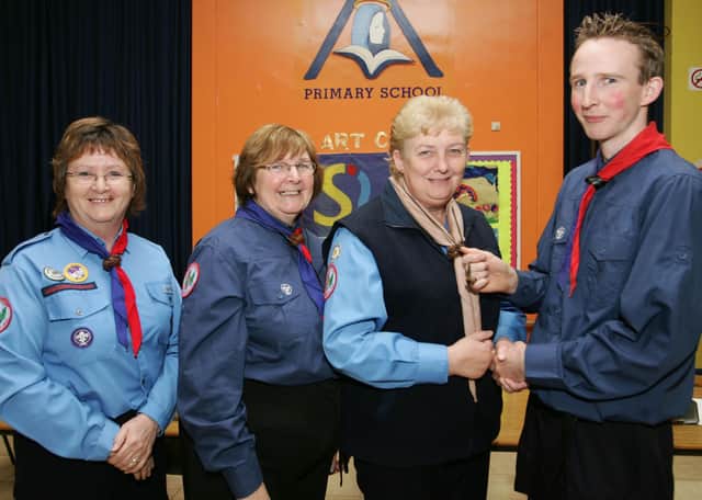 2007: Stalwart scouters Bernie Cassidy, Celine Taylor and Ann McDevitt from St Eugene's Scout Group being presented with the Wood Beads from Group leader Mark Taylor after completing their scouting Leadership training.  (2610JB08)