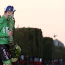 Team Deceuninck rider Ireland's Sam Bennett celebrates on the podium after winning the best sprinter's green jersey of the 107th edition of the Tour de France, in 2020. (Photo by KENZO TRIBOUILLARD / AFP) (Photo by KENZO TRIBOUILLARD/AFP via Getty Images)
