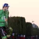 Team Deceuninck rider Ireland's Sam Bennett celebrates on the podium after winning the best sprinter's green jersey of the 107th edition of the Tour de France, in 2020. (Photo by KENZO TRIBOUILLARD / AFP) (Photo by KENZO TRIBOUILLARD/AFP via Getty Images)