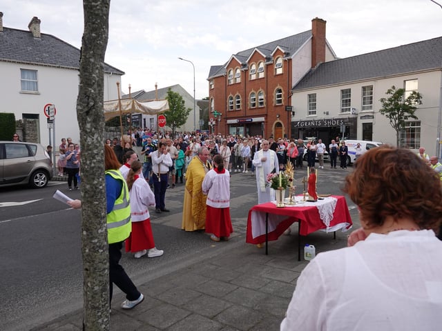 The Procession, which also includes Father Baker, makes it way down the Main Street.