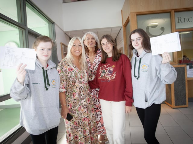 Mrs. Stacey Beattie, Vice Principal and Mrs. Mary Jo Carolan, Principal, St. Cecilia's College pictured with some happy A Level students on Thursday morning at the school.
