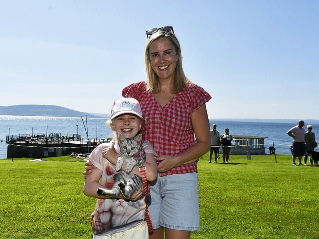 Pebbles with Lucy and Cathy McDermott at the Moville Summer Festival Pet Show, held on The Green. Photo: George Sweeney