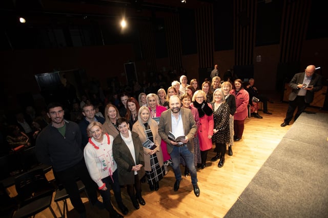 Feargal Friel, pictured with staff from Hollybush Primary School at Thursday's 'The In-between' book launch (a collection of poems) at An Culturlann, Derry. (Photos: Jim McCafferty Photography)