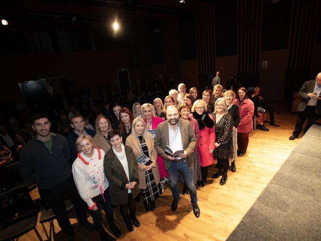 Feargal Friel, pictured with staff from Hollybush Primary School at Thursday's 'The In-between' book launch (a collection of poems) at An Culturlann, Derry. (Photos: Jim McCafferty Photography)