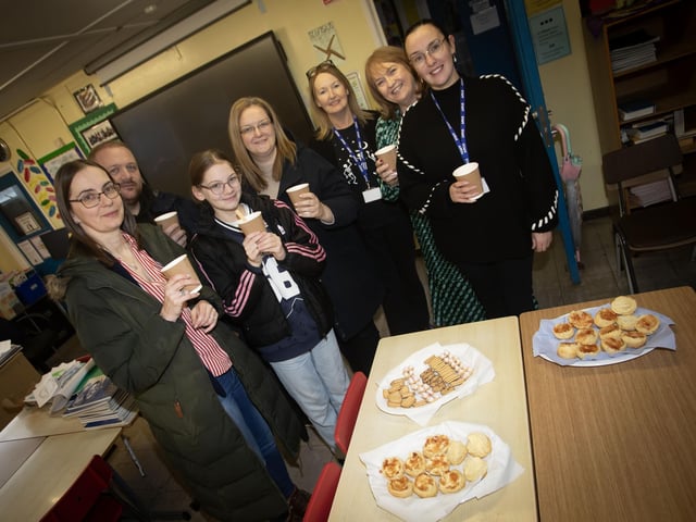 Some of the parents and staff who dried off with a cup of tea following the walk to Hollbush Primary on Wednesday last. : .