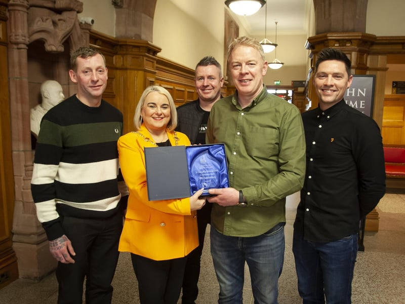 The Mayor of Derry City and Strabane District Council, Sandra Duffy makes a special presentation to Cahir Duffy, St. Joseph’s Boxing Club to mark the club’s celebration of 30 years in existence, during a reception in the Guildhall on Thursday night last. Included from left are Kwevin McIntyre, Ryan Tracey and Davy McFadden.