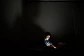 Child on a smartphone. (Photo: MARVIN RECINOS/AFP via Getty Images)